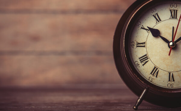 Retro Alarm Clock On A Table.