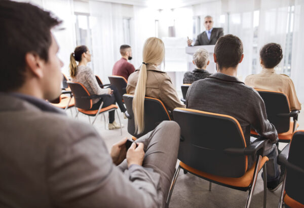 Group of business people attending an education event.